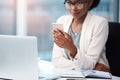 Business woman with a phone texting, browsing and searching social media while working in the office. Creative agent Royalty Free Stock Photo