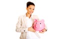 Business woman with a piggybank.