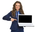 Business woman pointing on laptop blank screen Royalty Free Stock Photo