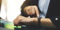 A business woman pointing at a wristwatch on her working time while waiting for someone Royalty Free Stock Photo