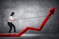 Business Woman Pulling Arrow With Chain