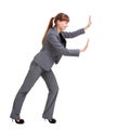 Business woman pushing something Royalty Free Stock Photo