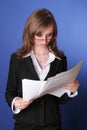 Business woman reading carefully a file Royalty Free Stock Photo