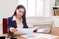 Business woman reading document at office desktop Royalty Free Stock Photo