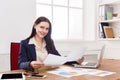 Business woman reading document at office desktop Royalty Free Stock Photo