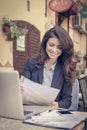 Business woman reading a documents, at cafe. Royalty Free Stock Photo