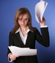 Business woman reading impatiently a file Royalty Free Stock Photo