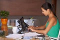 Business woman, reading and planning on laptop for financial research, email or internet in her office. Young worker or Royalty Free Stock Photo