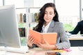 Business woman reads book at office desk Royalty Free Stock Photo