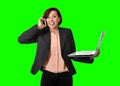 Business woman with red hair talking on the mobile cell phone holding laptop in hand isolated on green screen croma Royalty Free Stock Photo