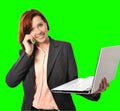 Business woman with red hair talking on the mobile cell phone holding laptop in hand isolated on green screen croma Royalty Free Stock Photo