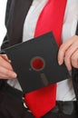 Business woman red tie holding floppy Royalty Free Stock Photo