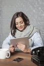 Business woman relaxes in the office, reads something on the int