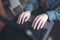 A business woman`s hands working and typing on laptop keyboard on the table Royalty Free Stock Photo