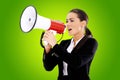 Business woman screaming loudly thru big megaphone Royalty Free Stock Photo