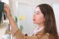 Business woman Searching files and and reading book in the cabinet or books shelves Royalty Free Stock Photo