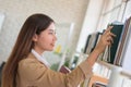 Business woman Searching files and and reading book in the cabinet or books shelves Royalty Free Stock Photo