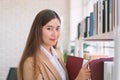 Business woman Searching files and and reading book in the cabinet or books shelves Royalty Free Stock Photo