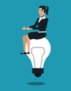 Business woman seated on bulb