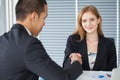 business woman shaking hands with businessman in office . girl looking at camera Royalty Free Stock Photo