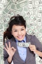 Business woman show ok with money bed Royalty Free Stock Photo