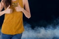 Business woman show thumbs up with smoke in background Royalty Free Stock Photo