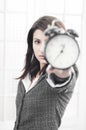 Business woman showing a clock Royalty Free Stock Photo