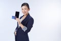 Business woman showing plastic credit card and mobile phone. concept business, shopping online, internet, blanking