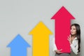 Business Woman Showing Rising Arrow Columns, Representing Business Growth. Business Success and Shares Up Concept