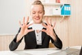 Business woman showing a small card for an inscription