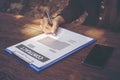 Business woman signing contract document on garden desk Royalty Free Stock Photo