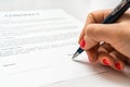 Business woman signing contract document in office