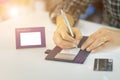 Business woman signing credit card slip close-up slightly blurred