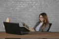 Business woman sits in her office and reads a book, a form of stress relief Royalty Free Stock Photo