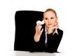 Business woman sitting behind the desk and holding a toy plane Royalty Free Stock Photo