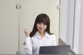 Business woman sitting at her desk with Laptop computer in office