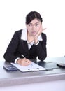 Business woman sitting on her desk and thinking with documents s Royalty Free Stock Photo