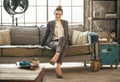 Business woman sitting in loft apartment on couch Royalty Free Stock Photo