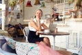 Business woman sitting in small coffee shop