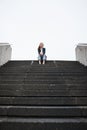 Business woman, sitting and stairs in portrait, low angle and mockup space in city, metro and relax on break. Young Royalty Free Stock Photo