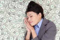 Business woman sleeping on money bed Royalty Free Stock Photo