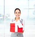 Business woman smile hold red gift box hands Royalty Free Stock Photo