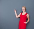 Business woman smiling and pointing to copy space Royalty Free Stock Photo