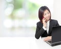 Business woman speaking phone and using computer Royalty Free Stock Photo