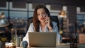 Business woman speaking smartphone at night workplace. Calling lady making notes Royalty Free Stock Photo