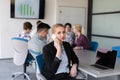 Business woman speeking on phone at office with team on meeting Royalty Free Stock Photo