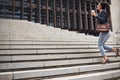 Business woman, stairs and coffee break with commute and work in city for job growth. Urban, lawyer and company steps Royalty Free Stock Photo