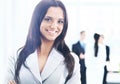 Business woman standing with her staff in background at office Royalty Free Stock Photo