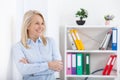 Business woman standing near the wall looking out the window thinking over the strategy. Royalty Free Stock Photo