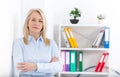 Business woman standing near the wall looking out the window thinking over the strategy. Royalty Free Stock Photo